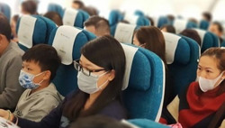 Hành khách đi máy bay không đeo khẩu trang sẽ bị phạt